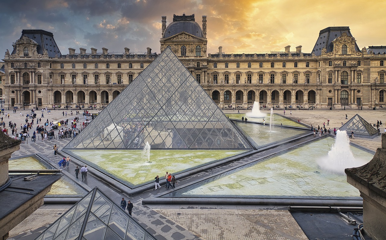 The Louvre with its distinct combination of a remodeled old palace and a newly constructed pyramid extension