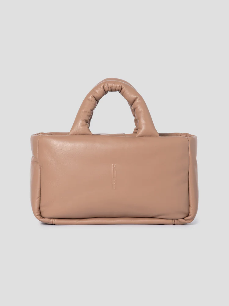 This leather cuboid padded bag by KUHO is soft to the touch.