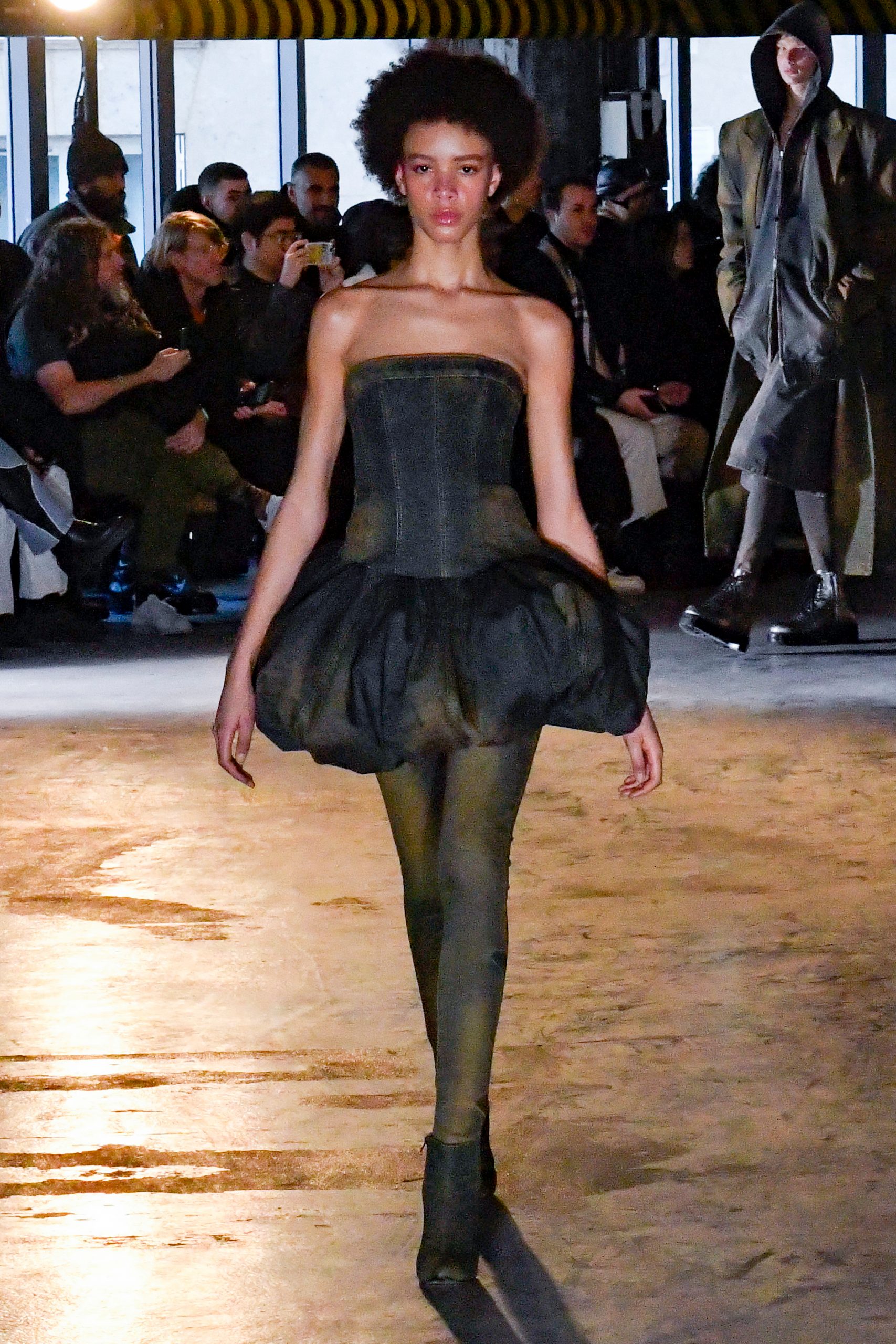 A black bubble dress on the catwalk at the Juun.J 2024 fall/winter show