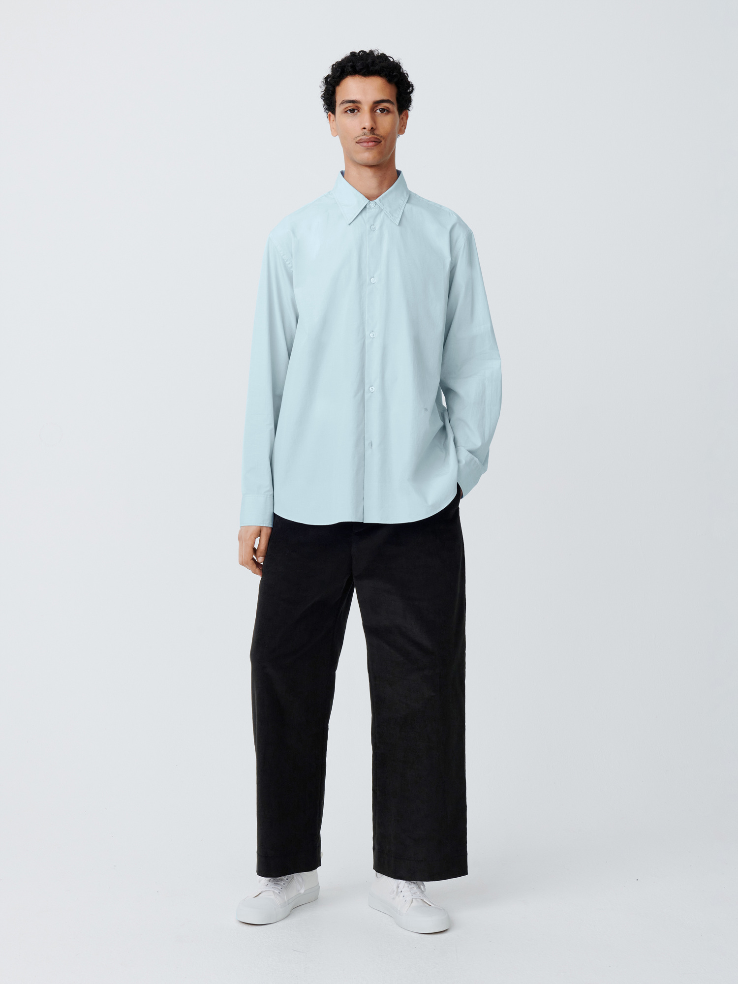 This shirt from Studio Nicholson is a very delicate, subtle shade of pale blue.
