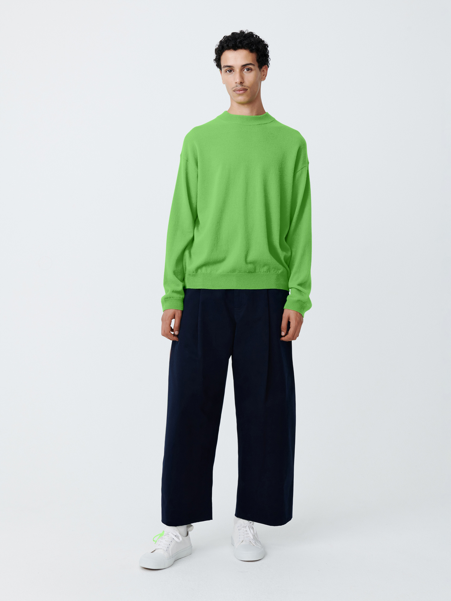 A bright, almost fluorescent, light green makes this Studio Nicholson sweater catch the eye.