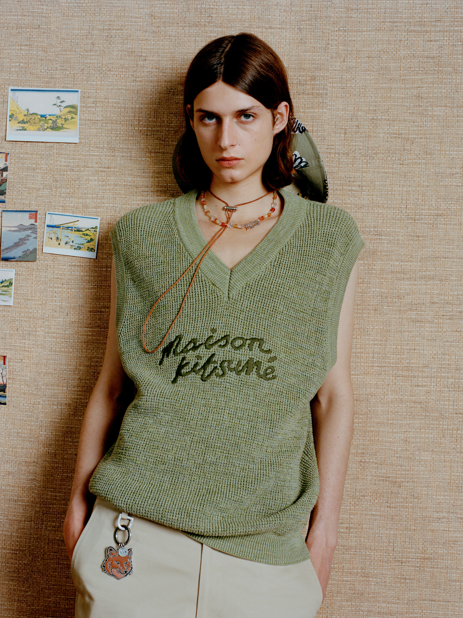 Go green with envy for this Maison Kitsuné sleeveless top in drab green.