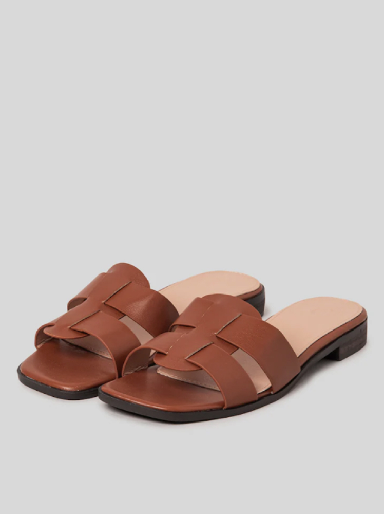 A pair of brown summer 8 Seconds slide-on sandals with a double strap detailing at the top of the shoe.