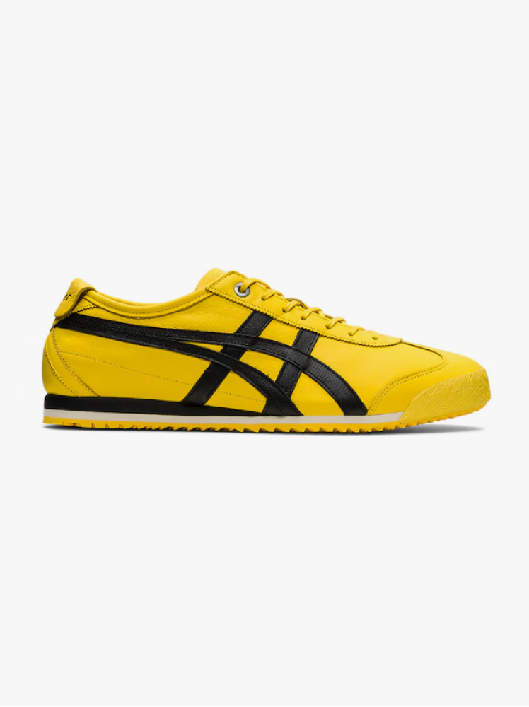 Vivid yellow Onitsuka Tiger sneakers with black stripes and yellow laces