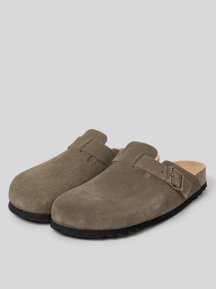 Neutral brown Scholl clogs with a buckle strap pictured