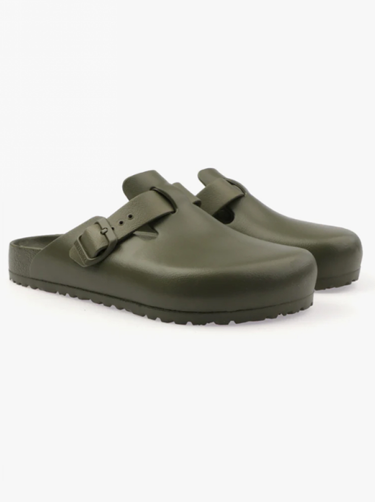 Khaki colored Birkenstock clogs with buckle detail