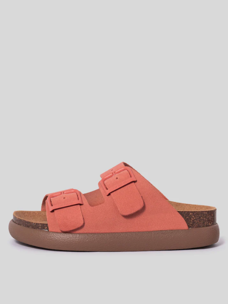 A coral-colored Scholl chunky sandal with thick buckle straps, a cork sole and a chunky rubber outer sole.