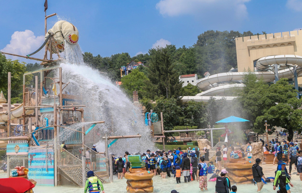 Korea's Caribbean Bay Adventure Pool is refreshing fun for the whole family; water pours out of the Skull Water Falls skeleton bucket and onto guests at the water park