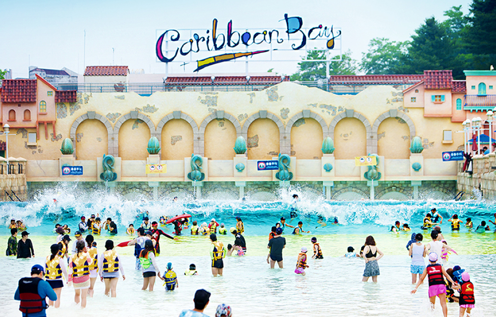 A crowd of swimmers float in the outdoor wave pool at Korea's Caribbean Bay