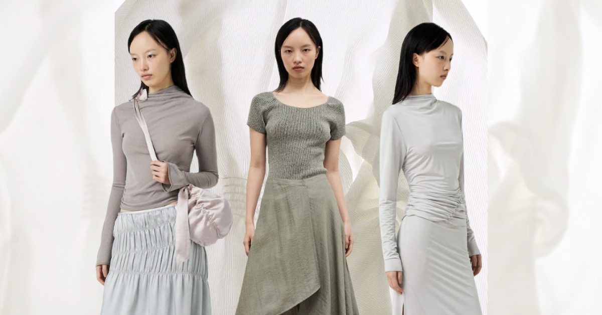 Anggae’s debut fashion collection styled on a model in three ways; the first outfit features a light grey mock-neck jersey top paired with a shirred pale blue satin skirt and a satin bag with gathered detailing. The model in the center wears a scoop neck green knit top paired with a layered linen skirt in the same color. The third model wears a matching top and skirt made from jersey material that hugs the body and creates a gathered detail effect.