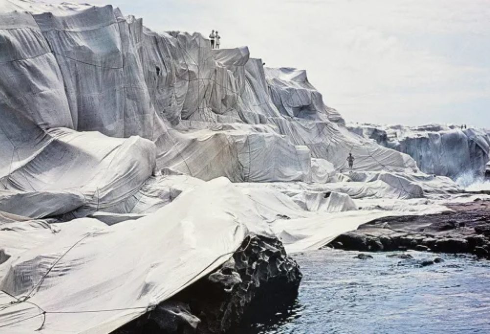 The iconic coastline of Sydney, Australia wrapped in 90,000 square meters of plastic fabric by artists Christo and Jeanne-Claude in 1969, original image credit belongs to The Sydney Morning Herald.