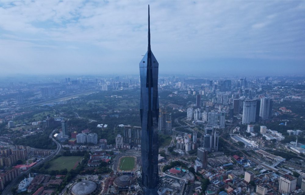 A view of Merdeka 118 in Malyasia’s Kuala Lumpur which towers over nearby parks and buildings that fade into the horizon. The Historical Significance of Merdeka 118’s Design