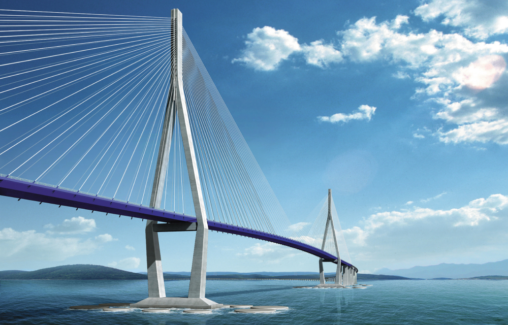 An image that captures the scale of the Incheon Bridge’s cable stayed design. On the left side of the image, cables of the bridge form a triangle shape. The bridge continues to fade into the background above the clear blue sea with mountains in the background. The Incheon Bridge is South Korea’s longest bridge and was constructed by Samsung C&T.