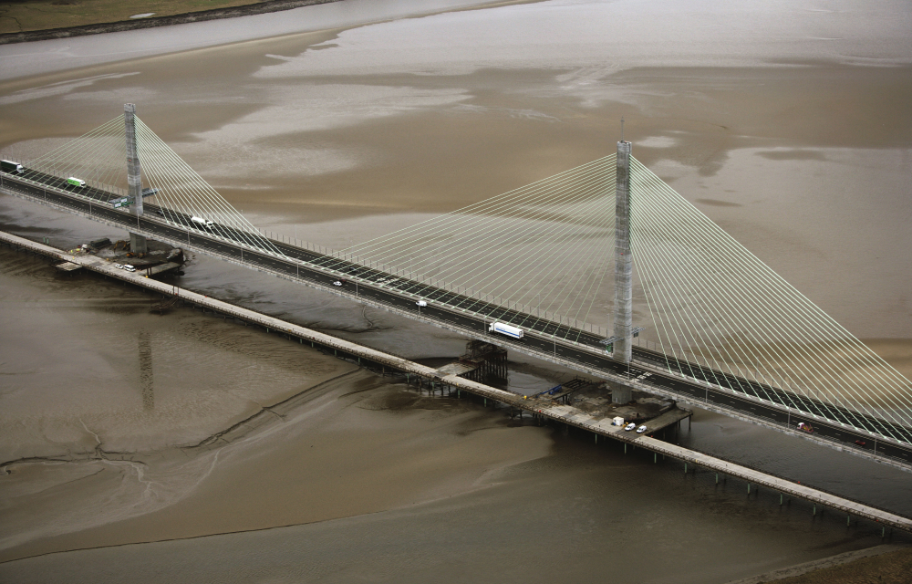 Looking down on the UK’s Mersey Gateway bridge that crosses the Mersey River in Liverpool. The cable-stayed bridge design is an engineering marvel.