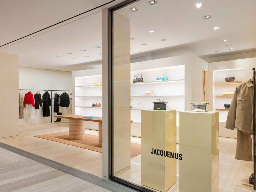 Soft yellow plinths are the focal point of the store’s window display