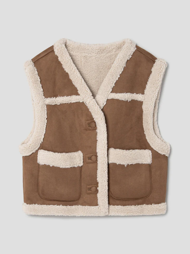 A brown suede-look vest with shearling hems and shearling pocket details.