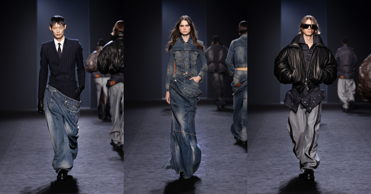 A trio of runway models presenting Juun.J’s Fall/Winter 2025 collection. The first model wears a tailored pinstripe jacket paired with baggy denim pants, the second model dons a structured denim jacket and matching skirt, and the third model sports an oversized leather jacket with loose denim trousers, reflecting a blend of contrasts in textures and styles.