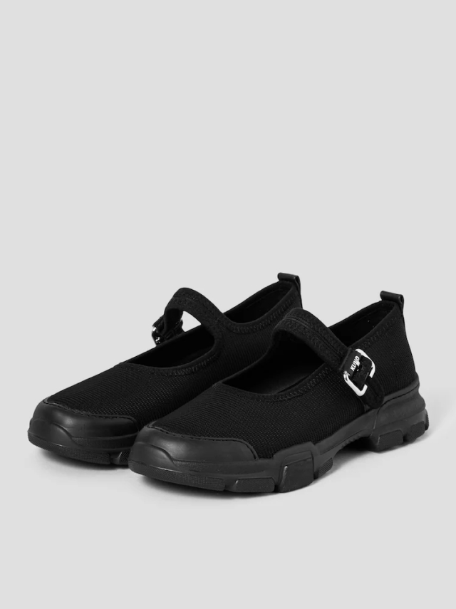 KUHO black mary jane sneakers with a sneaker-like sole and mesh-textured upper. The Mary Jane straps feature a silver metal buckle detail.