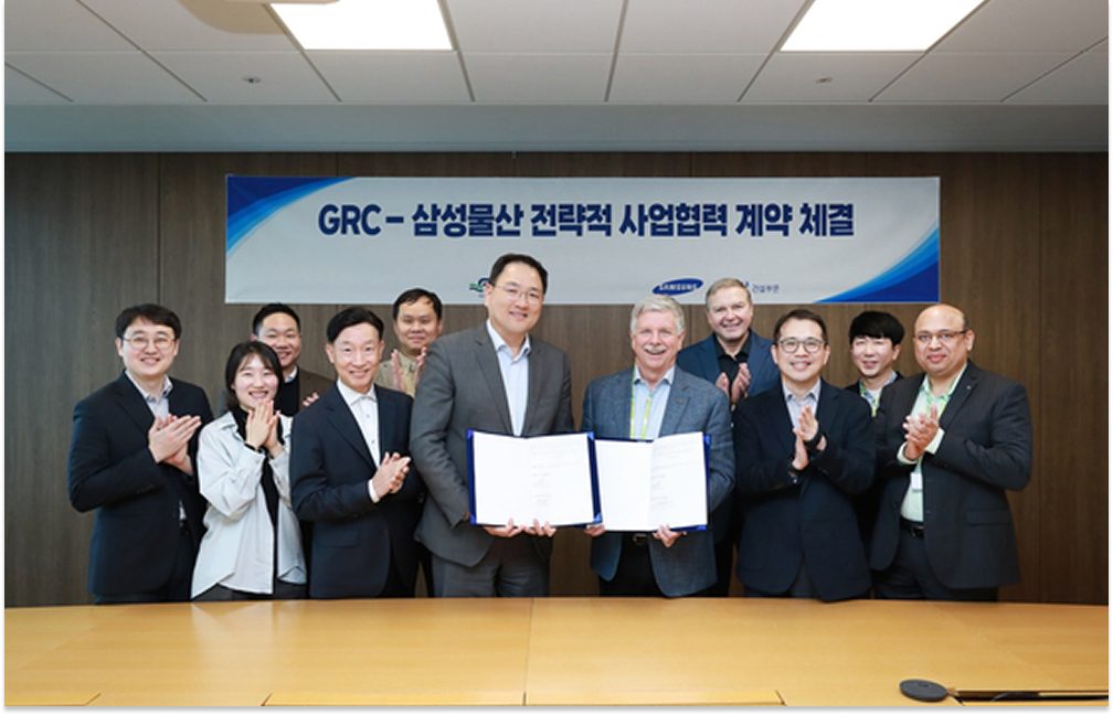 Executives from Samsung C&T E&C Group and Green Revolution Cooling (GRC) pose with a signed agreement during their strategic partnership ceremony.