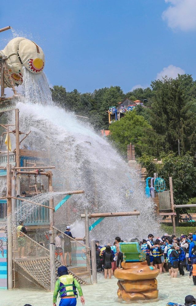 Korea's Caribbean Bay Adventure Pool is refreshing fun for the whole family; water pours out of the Skull Water Falls skeleton bucket and onto guests at the water park