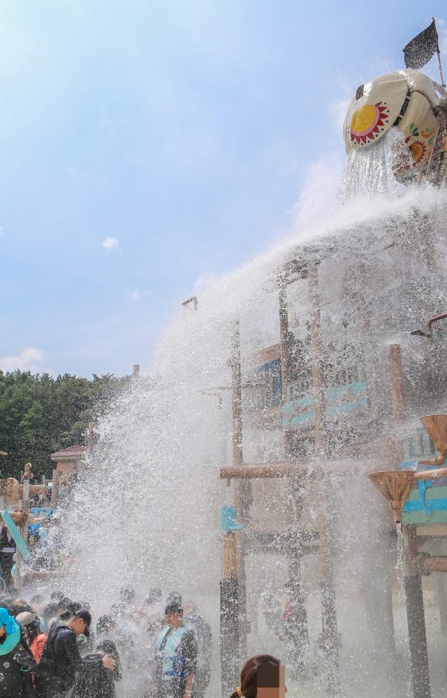 Korea's Caribbean Bay Adventure Pool is refreshing fun for the whole family; water pours out of the Skull Water Falls skeleton bucket and onto guests at the water park