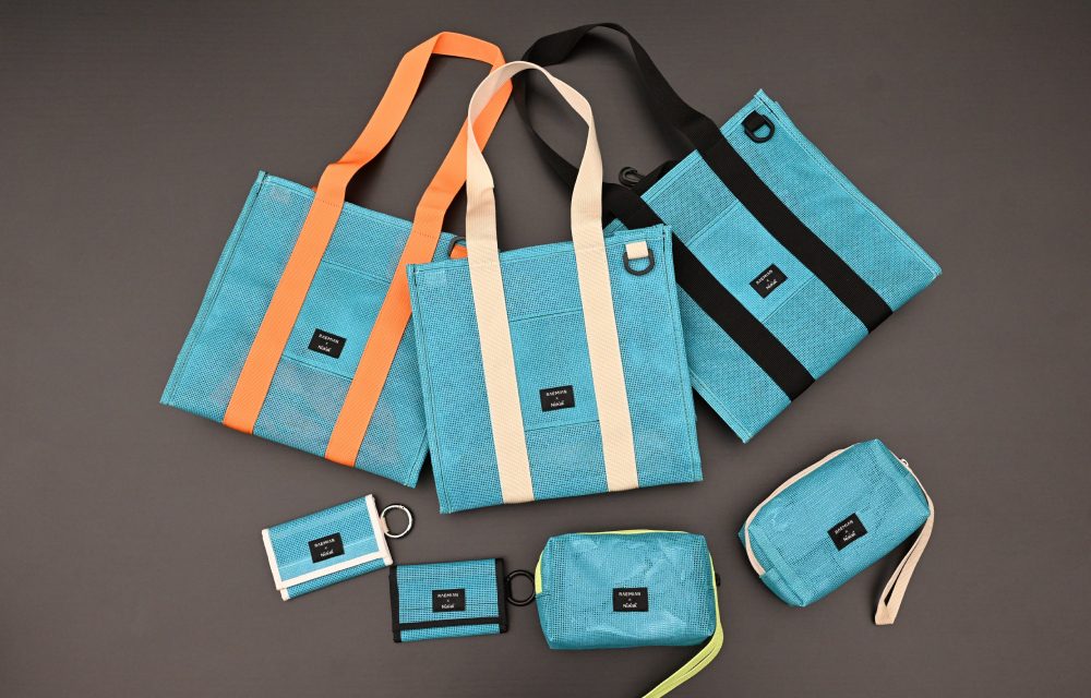 A collection of upcycled accessories from Samsung C&T E&C Group’s Raemian upcycled collection, including tote bags, pouches, and wallets. The items are turquoise with orange and black accents, made from repurposed vertical safety netting used on Raemian apartment construction sites.