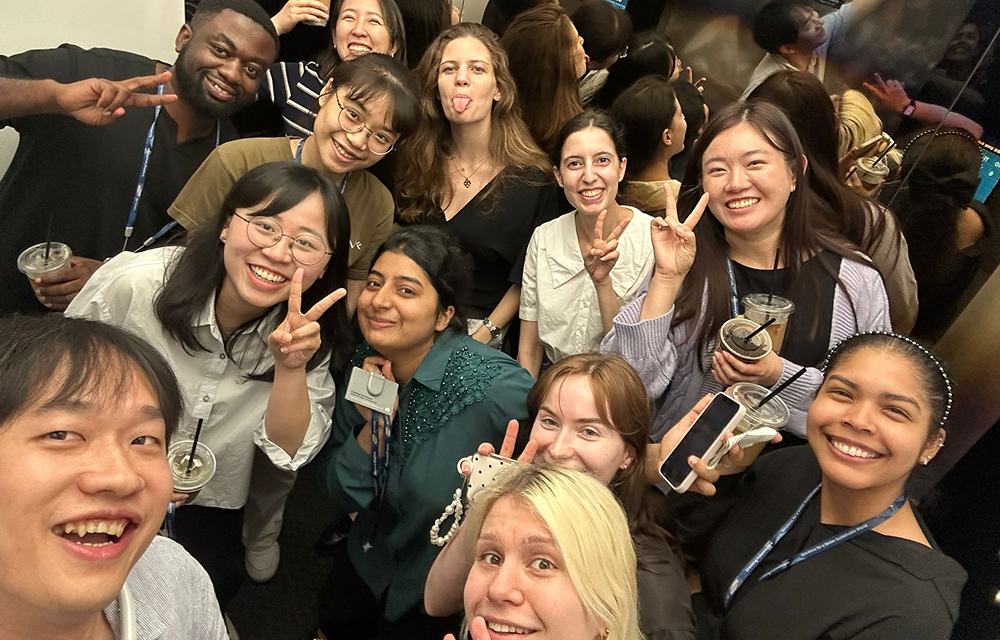 A cheerful moment captured among colleagues, showing the energy and connection shared at Samsung C&T E&C