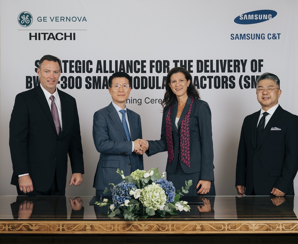 Executives from Samsung C&T and GE Vernova Hitachi Nuclear Energy stand together at the signing ceremony, with Samsung C&T President Oh Se-chul and GE Vernova Power CEO Mavi Zingoni shaking hands at the center.
