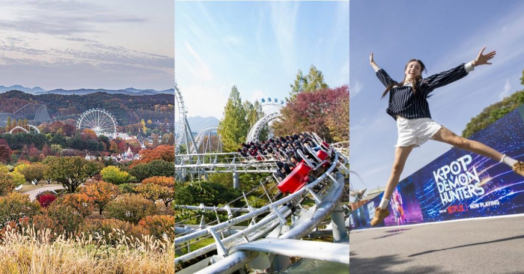 Panoramic view of Everland surrounded by colorful fall foliage, a roller coaster winding through autumn trees, and a visitor jumping in front of the K-Pop Demon Hunters display at the park entrance.
