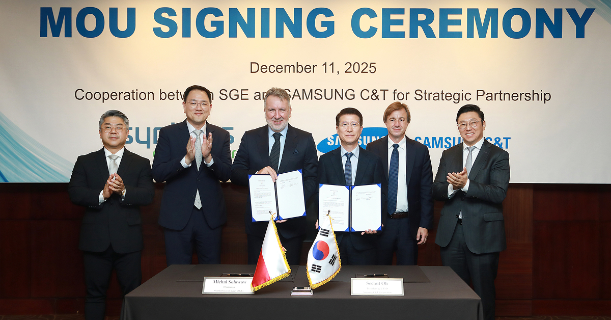 Executives from Samsung C&T and Synthos Green Energy hold signed documents during an MoU signing ceremony in Seoul on December 11, 2025.