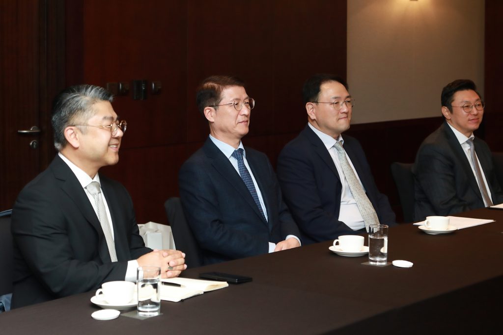 Samsung C&T and Synthos Green Energy representatives seated at a meeting table during discussions in Seoul.