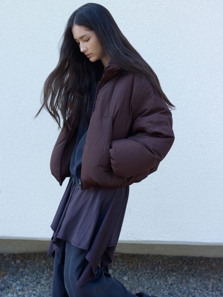 Model wearing an Anggae 2025 FW layered outfit designed for flexible, multi-way styling.