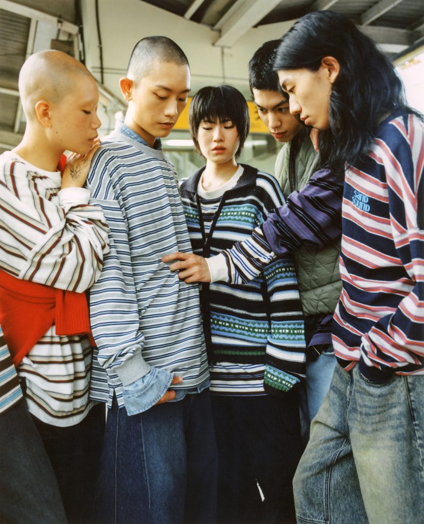 Models wearing relaxed knitwear from the SAND SOUND FW25 collection, featuring layered silhouettes and casual styling for everyday winter wear.