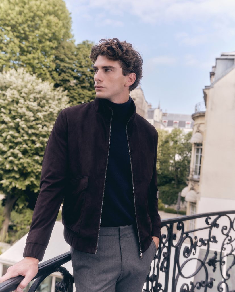 Model wearing Galaxy wool-blend slacks styled with a zip-up jacket, showcasing a refined yet relaxed office wear silhouette suitable for contemporary work environments.