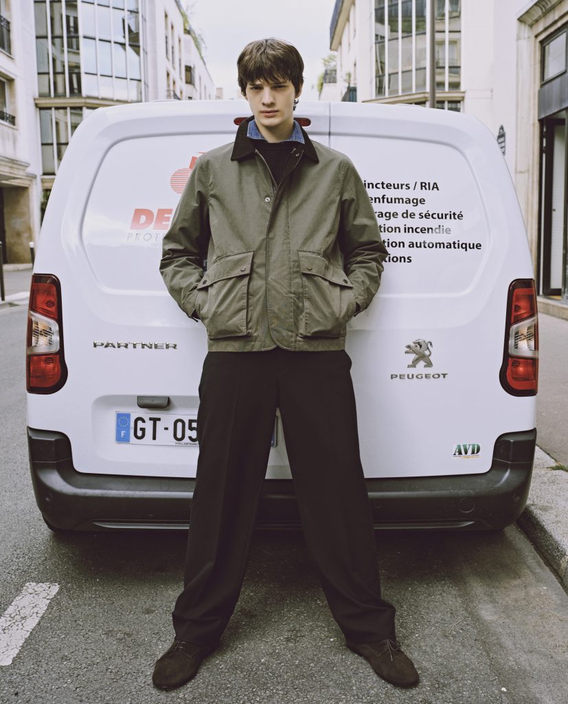 Model wearing a Rogatis nylon–poly cotton blend utility jacket with functional detailing, reflecting modern utilitarian styling for transitional everyday wear.