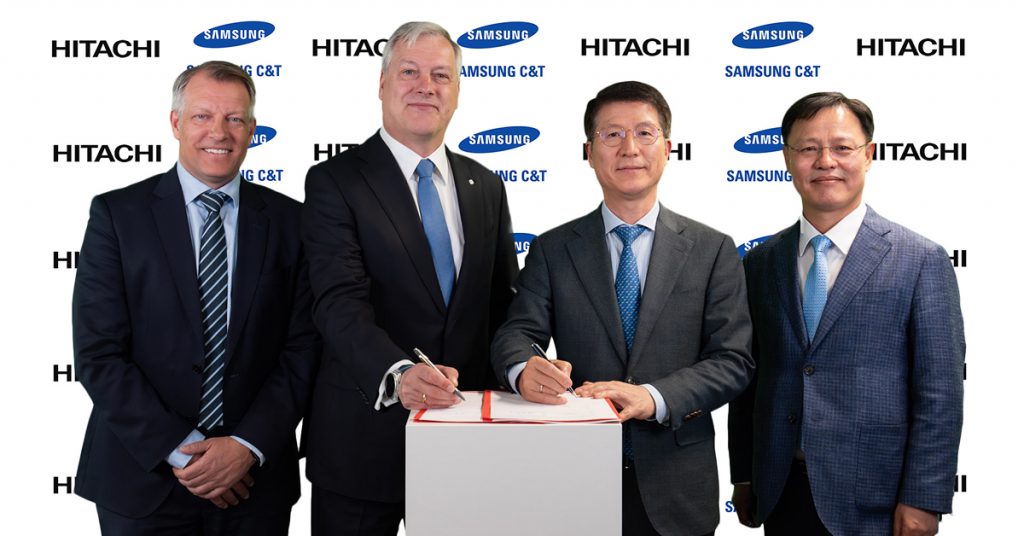 Executives from Samsung C&T and Hitachi Energy sign an agreement during an MOU ceremony for European power grid collaboration