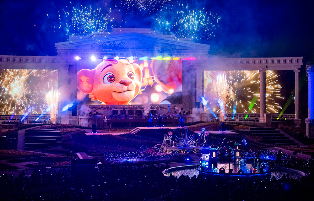 Fireworks and large LED screen during The Guardians of Light nighttime show at Everland's Four Seasons Garden.