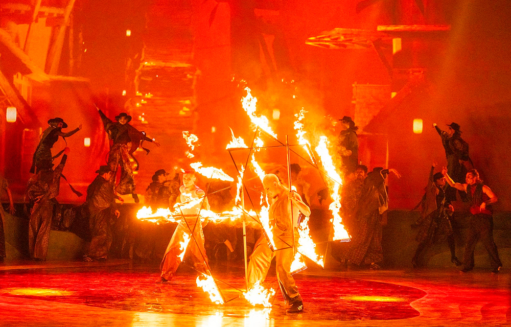 Cirque Éloize performers create large fire effects on stage during Wings of Memory at Everland.