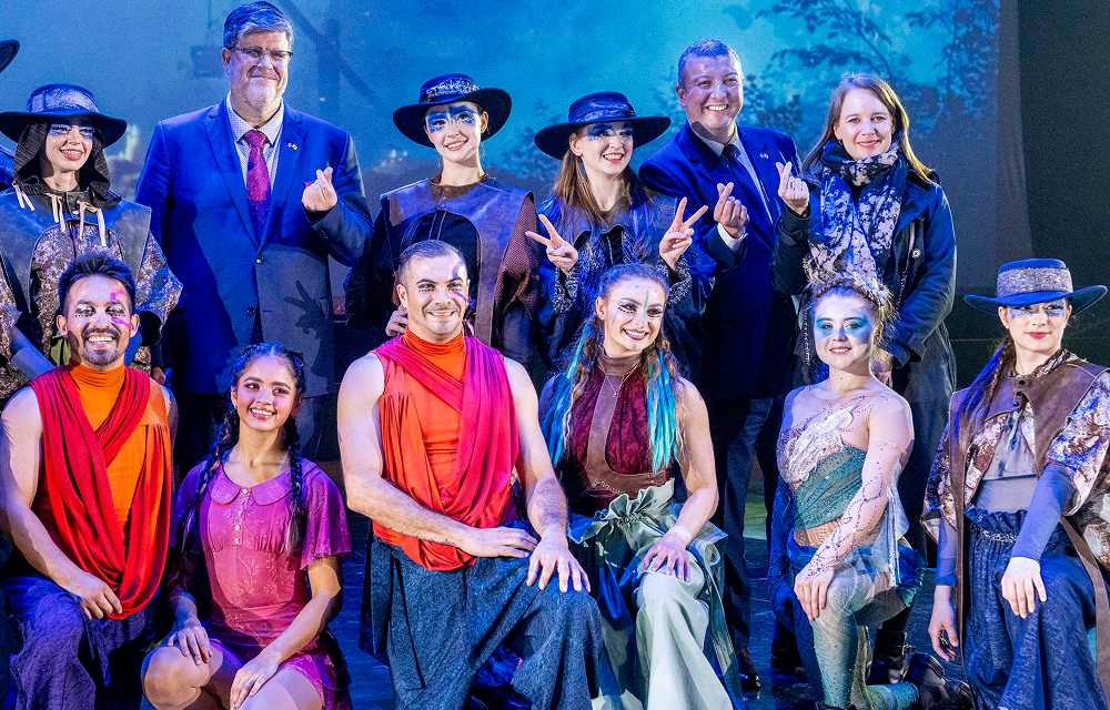 Canadian Ambassador to Korea and Québec Government representatives pose with Cirque Éloize performers in costume on stage following the Wings of Memory circus performance at Everland