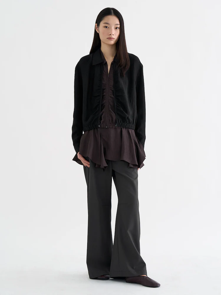 ‘anggae’ Satin Zip-Up Shirt in black offers a lightweight layer for refined spring styling