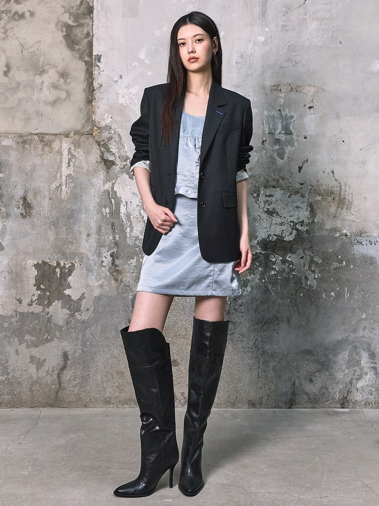 kuho plus Signature Semi Overfit Jacket in black styled with a dress, highlighting relaxed tailoring for spring layering