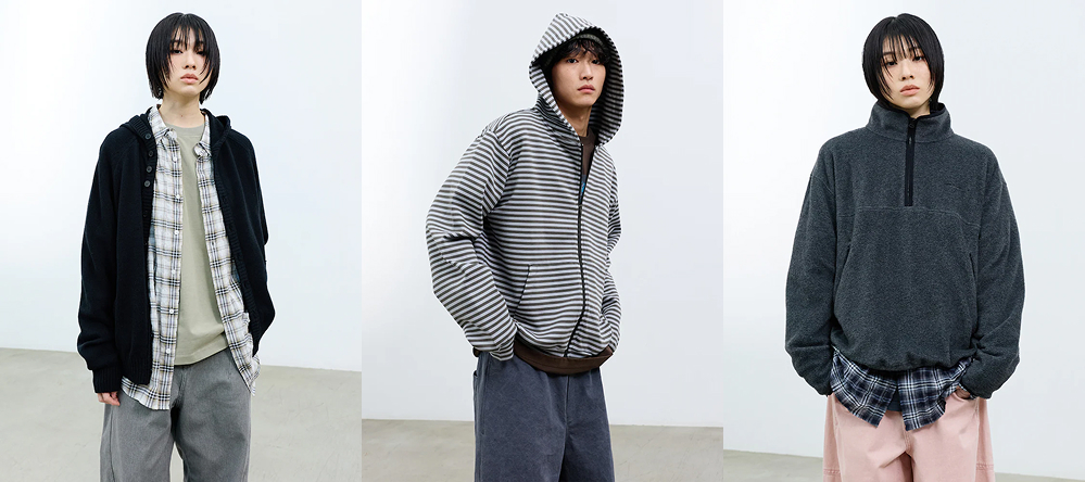 Models wearing SAND SOUND 26SS first drop outfits featuring layered hoodies, striped zip-up hoodie, check shirts, and relaxed-fit pants in neutral tones.
