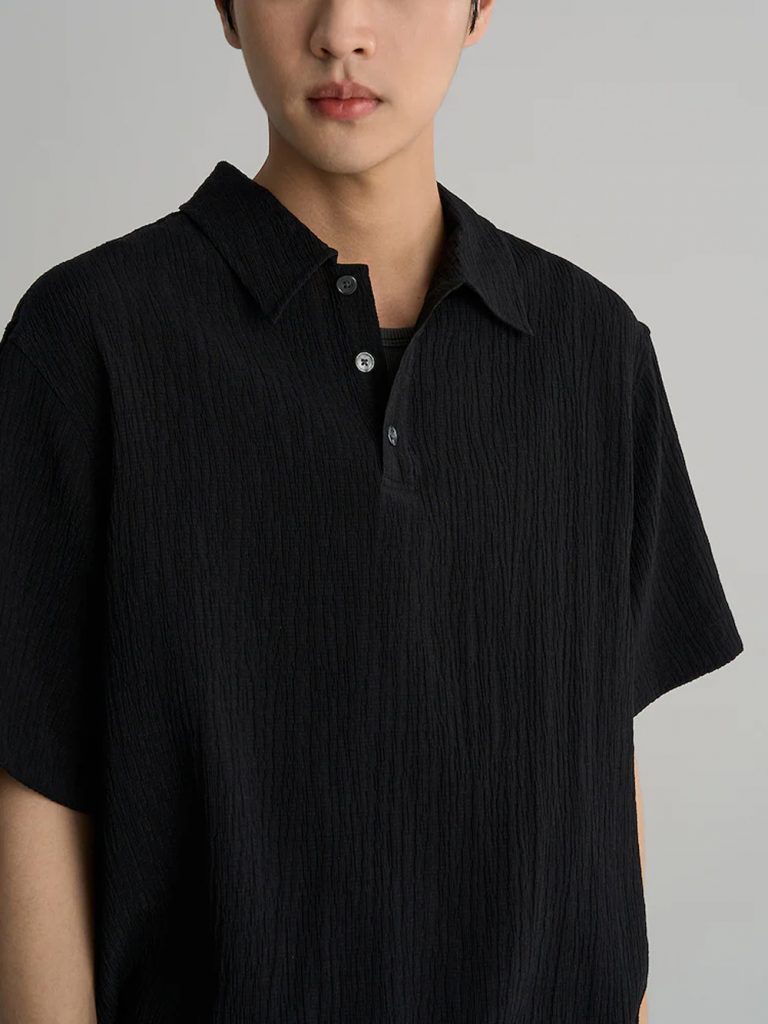 Model wearing 8seconds ALL-DAY CREASE Pullover Shirt in black with matching black pants.