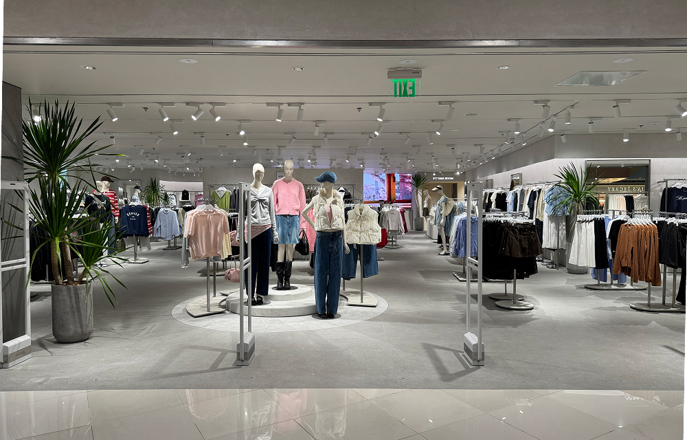 Wide view of the 8seconds store interior at SM Megamall in Manila, showing a spacious layout with clothing racks, mannequins, and a modern retail design