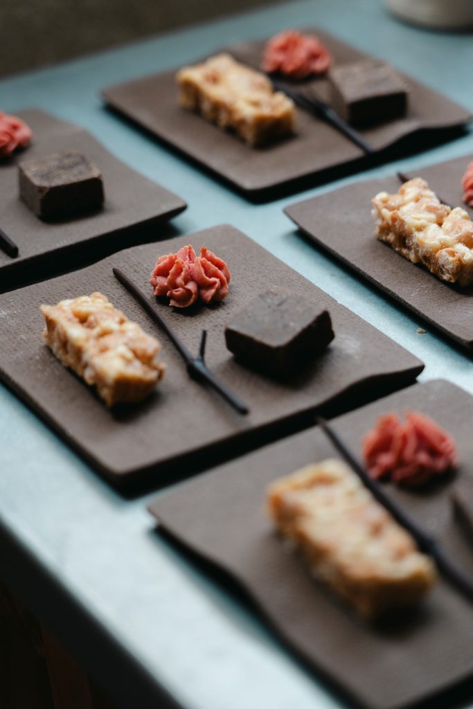 IAAC ceramic tableware displayed with small desserts at the 26SS pop-up store by ‘anggae’.
