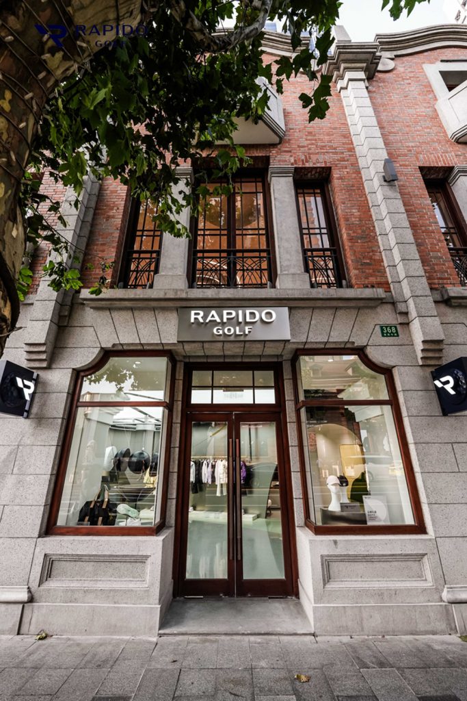 The RAPIDO GOLF entrance blends contemporary retail design with Shangxianfang’s historic stonework and brick façade